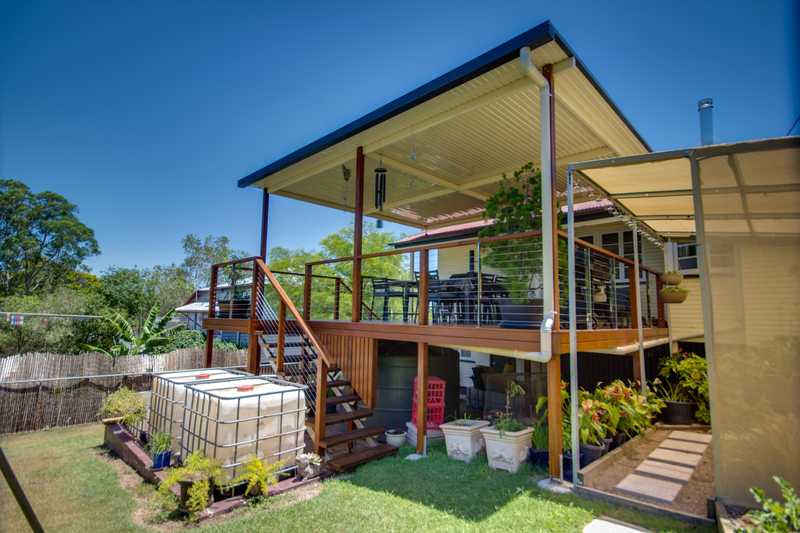 high level deck with flyover roof by DeKing Decks